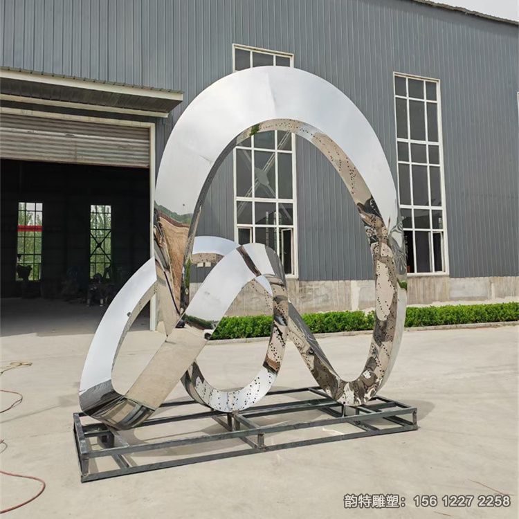 大型不銹鋼飄帶雕塑，紅色發(fā)光絲帶雕塑圖片